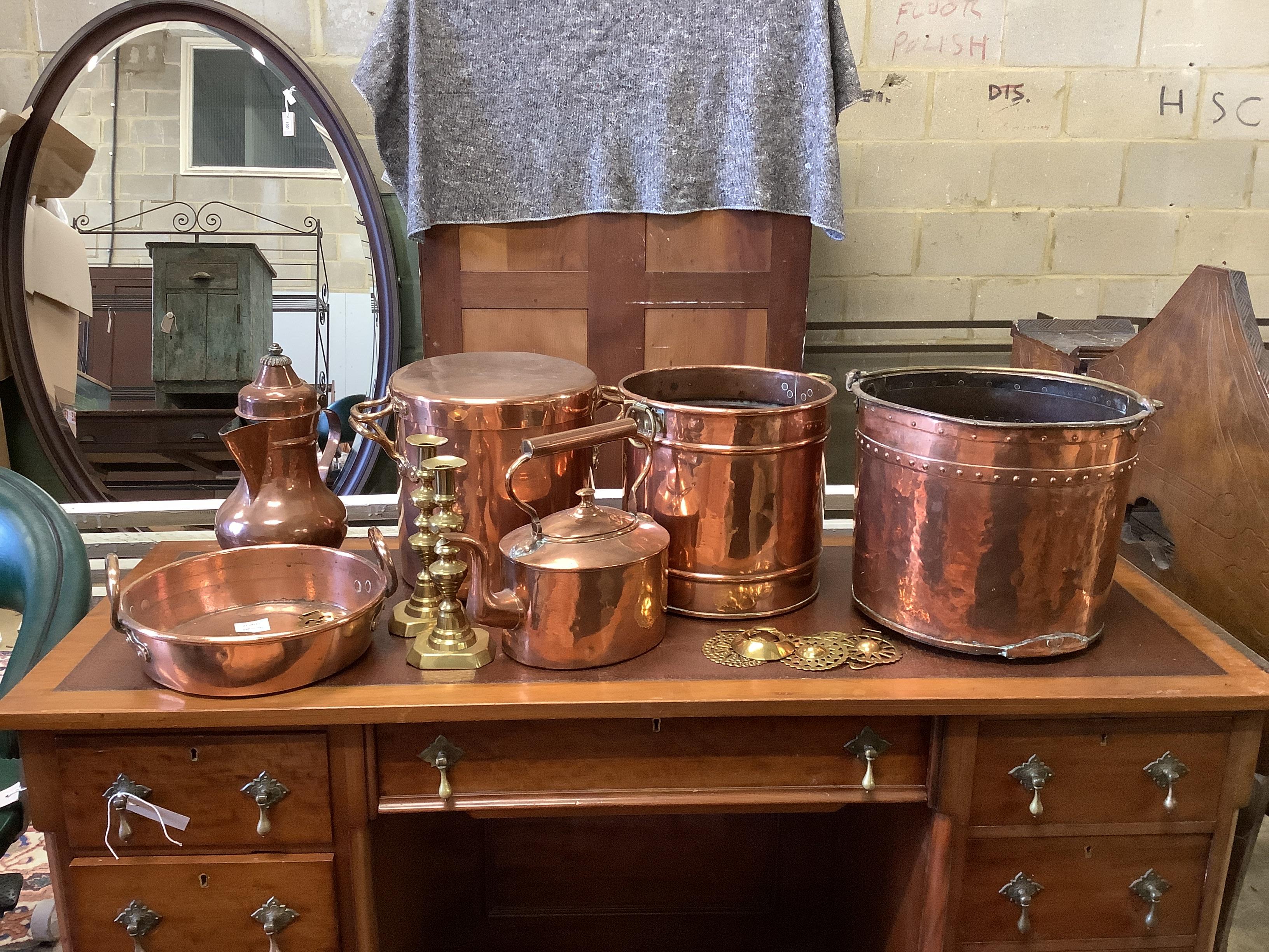 A collection of Victorian copper and brassware to include a riveted circular coal bucket, preserve pan and lidded pan, etc.